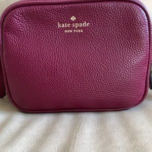 Burgundy Kate Spade camera bag. Smaller crossbody. Brand new In packaging still